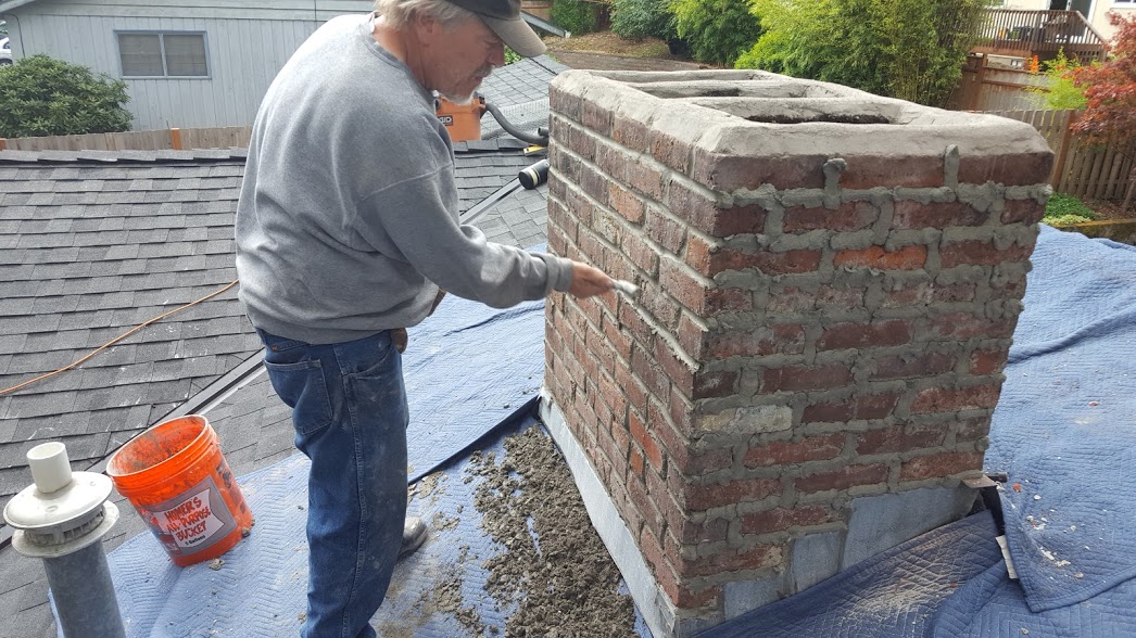 Mortar joints on a chimney being replaced. Also known as "tuck pointing."